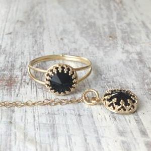 Gold ring, gold and black , black s..